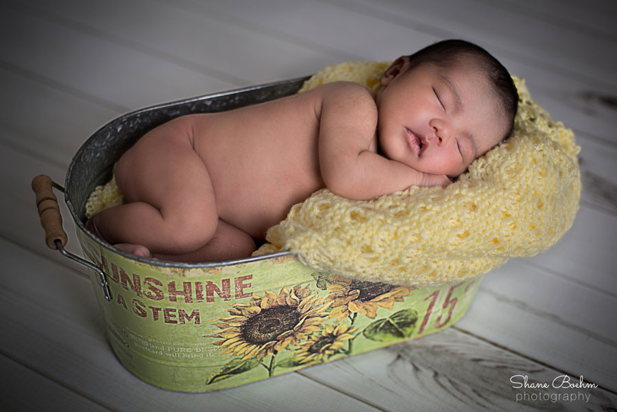 Newborn Sleeping in Tin Bucket